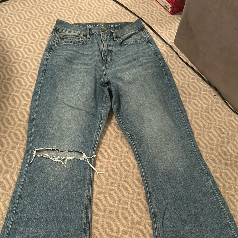Blue jeans with one rip on the knee- American eagle. Size 4 Short. Bootcut